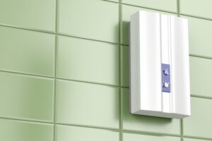 tankless-water-heater-mounted-on-green-tiles