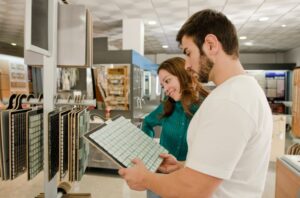 couple-looking-at-tile-samples-in-store