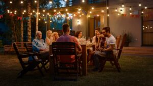 patio-party-with-outdoor-lights-group-of-people-around-table