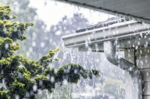 torrential-rain-overwhelming-gutters-on-roof